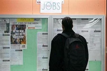 A man browsing through available jobs at a local unemployment office