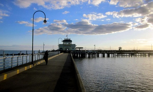 Tourist walks off pier while browsing on Facebook
