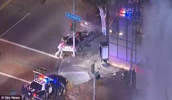 WATCH The moment LAPD officer shot dead 'drunk' Corvette driver live on TV