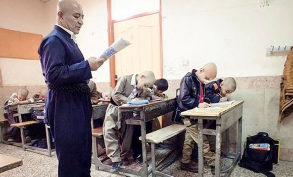 Hairless hero Iranian teacher shaves head in solidarity with bullied pupil