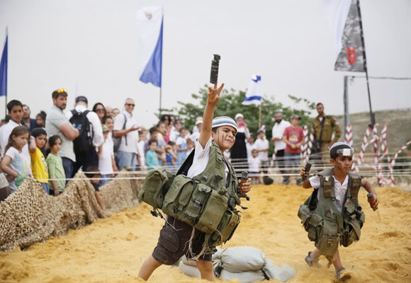 Disturbing photos show militarization of Israeli children