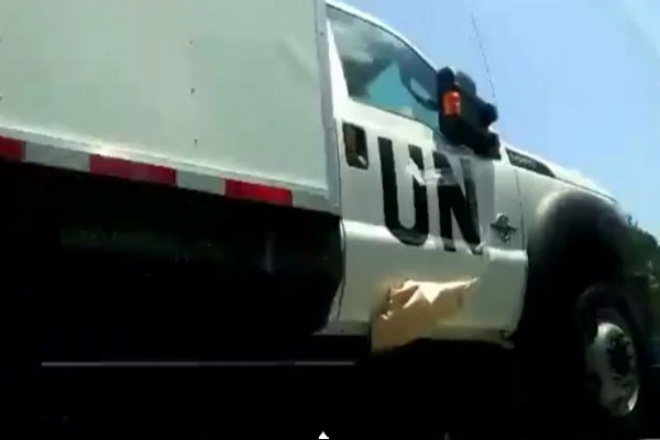Why are United Nations Medical Trucks covering up their logo while traveling on US highways