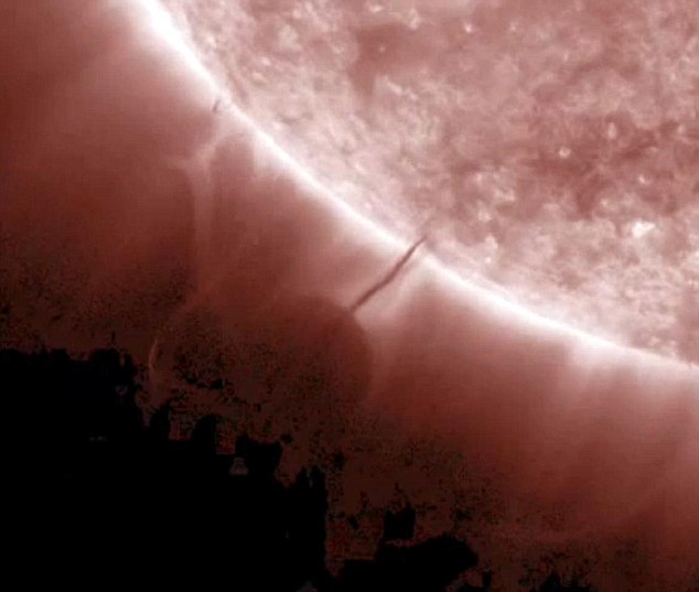 Conspiracy theories claim mysterious planet-sized ‘Death Star’ has been captured on video as it ‘refuels’ at the surface of the sun