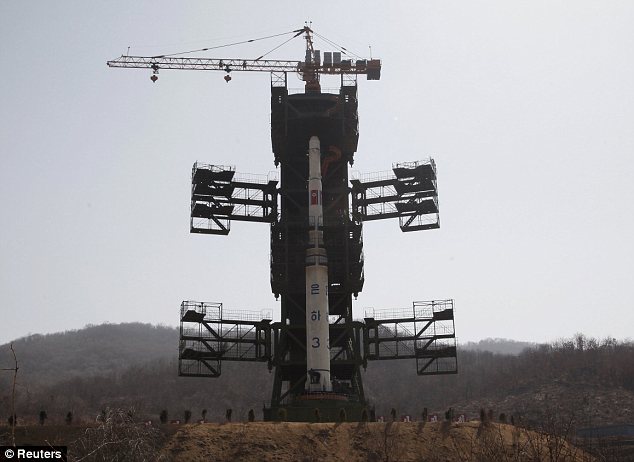 North Korea launches controversial long-range rocket but it blows up 90 SECONDS after take-off