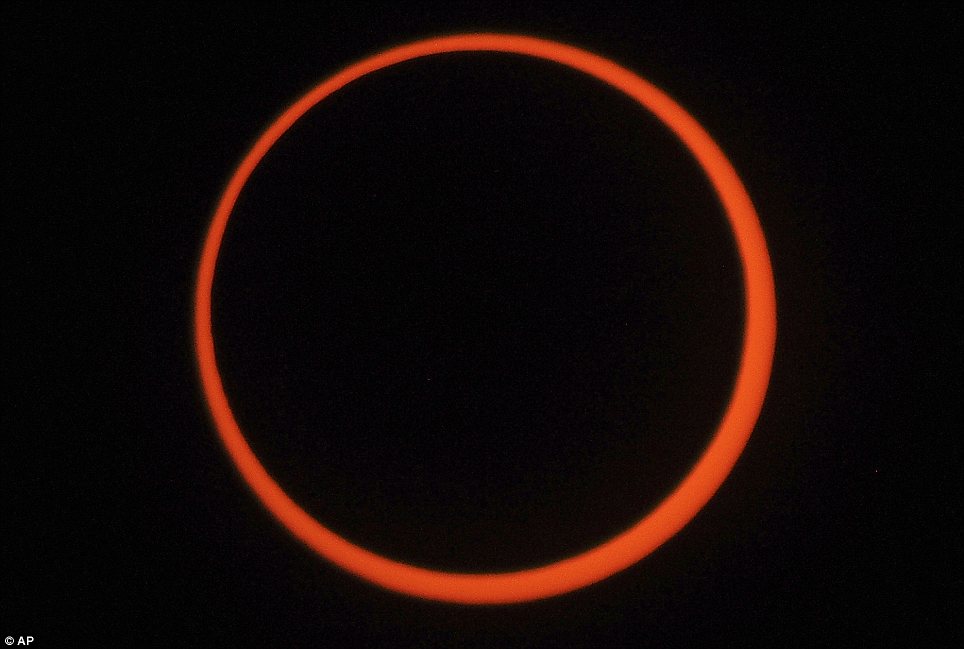 And it burns, burns, burns – the ring of fire! Solar eclipse dazzles in the sky above western U.S. and Asia
