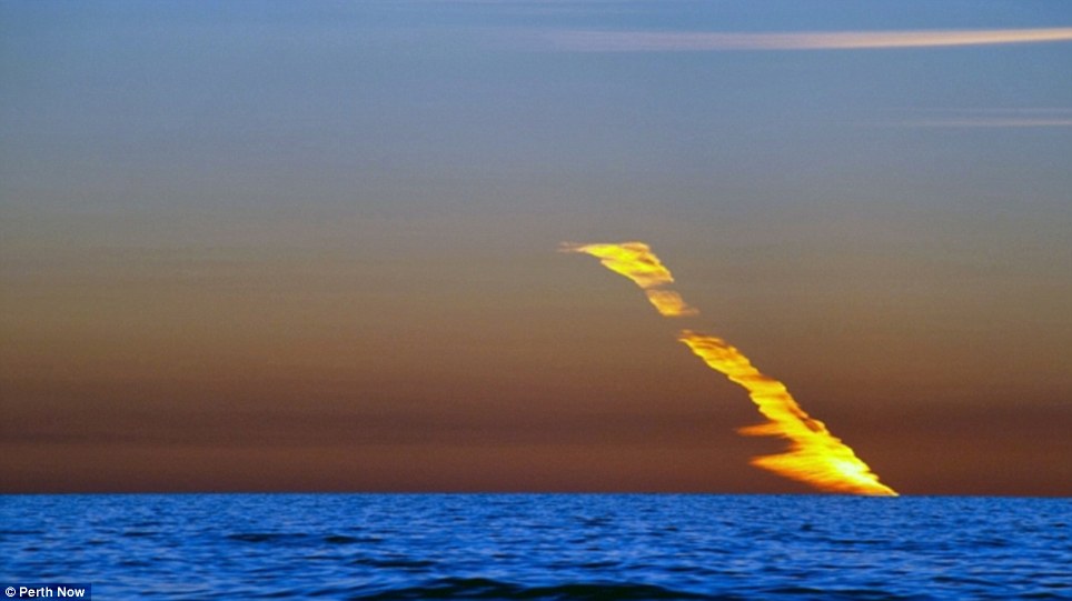 Fire in the sky: Burning meteorite trail lights up Australian sky for 20 minutes after rock plunges into the sea