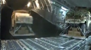 Crazy video: Heavy military trucks being dropped from a plane