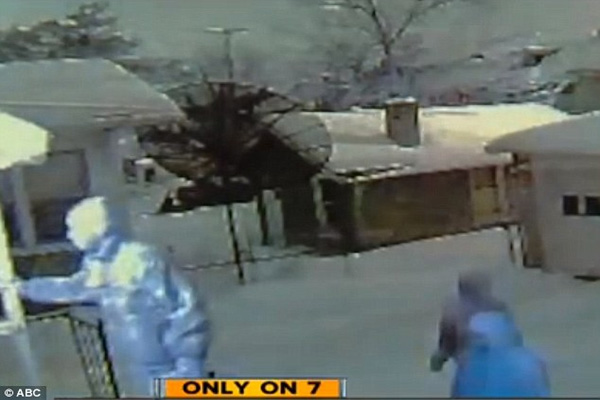 CCTV captures moment Detroit mother opens fire on home invaders with rifle