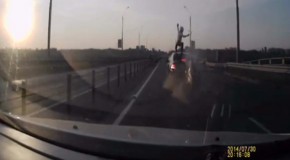 Video: ​Biker survives rear-ending car by vaulting on to its roof