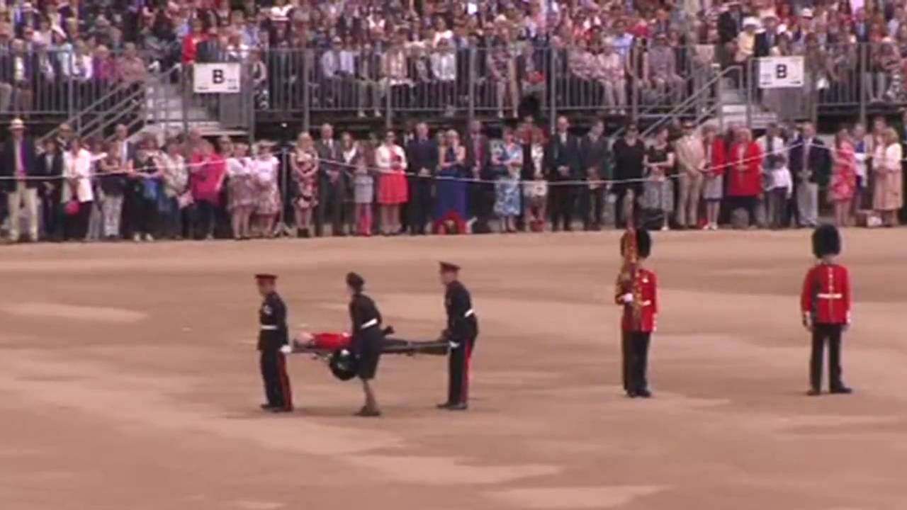 Guardsman carried off in a STRETCHER after COLLAPSING at ceremony [FULL VIDEO]