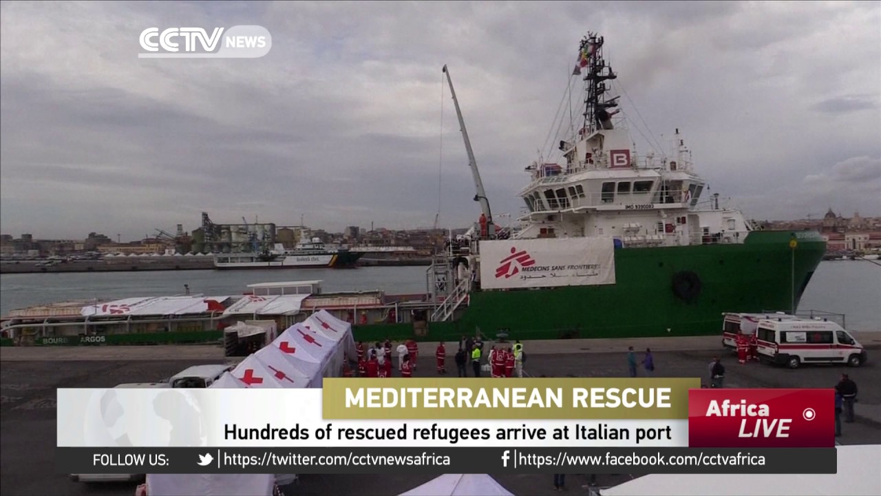 Hundreds of rescued refugees arrive at Italian port of Catania