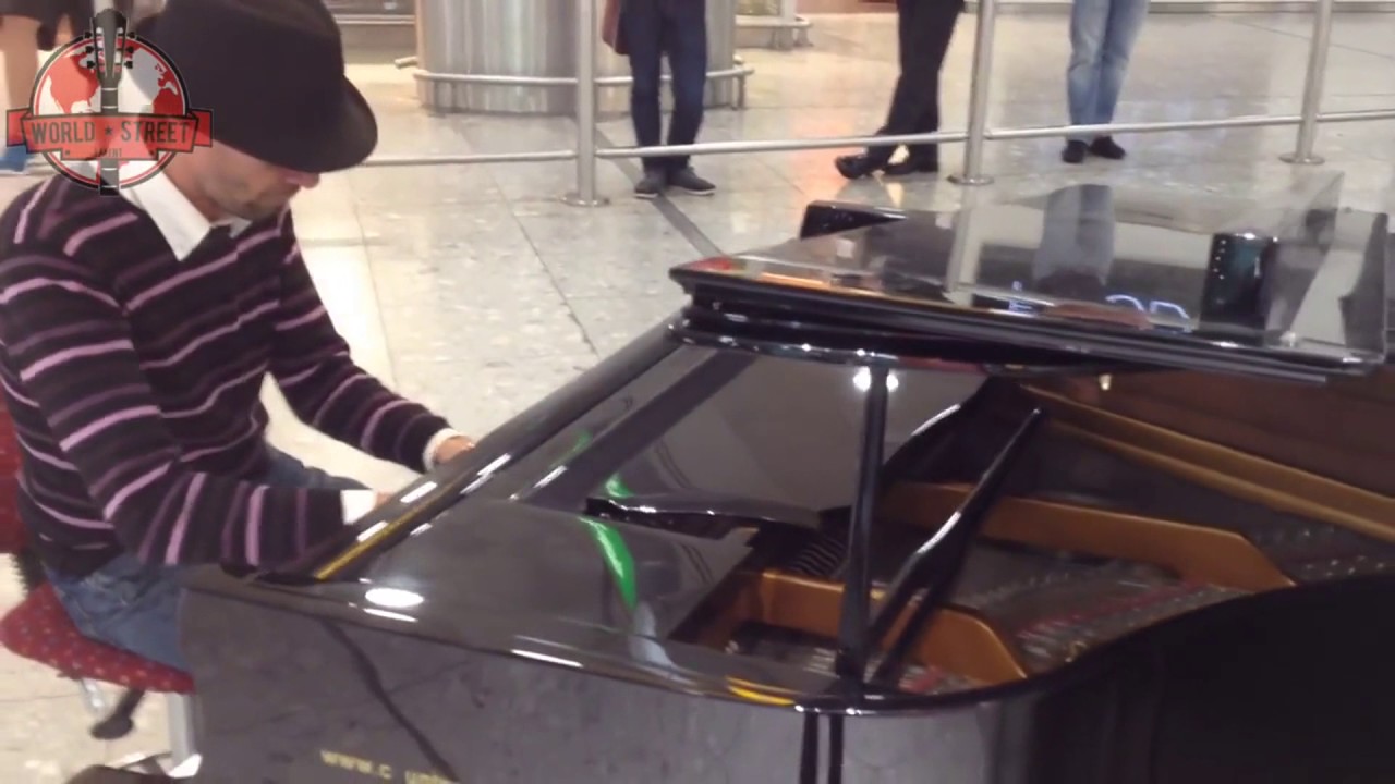Amazing Performance By a pianist at Heathrow airport arrivals hall! HD