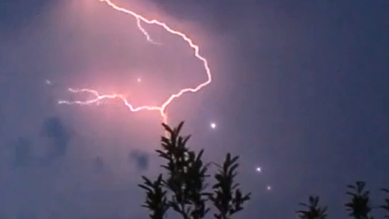 Spectacular UFOs flying through Lightning Strike, June 2014